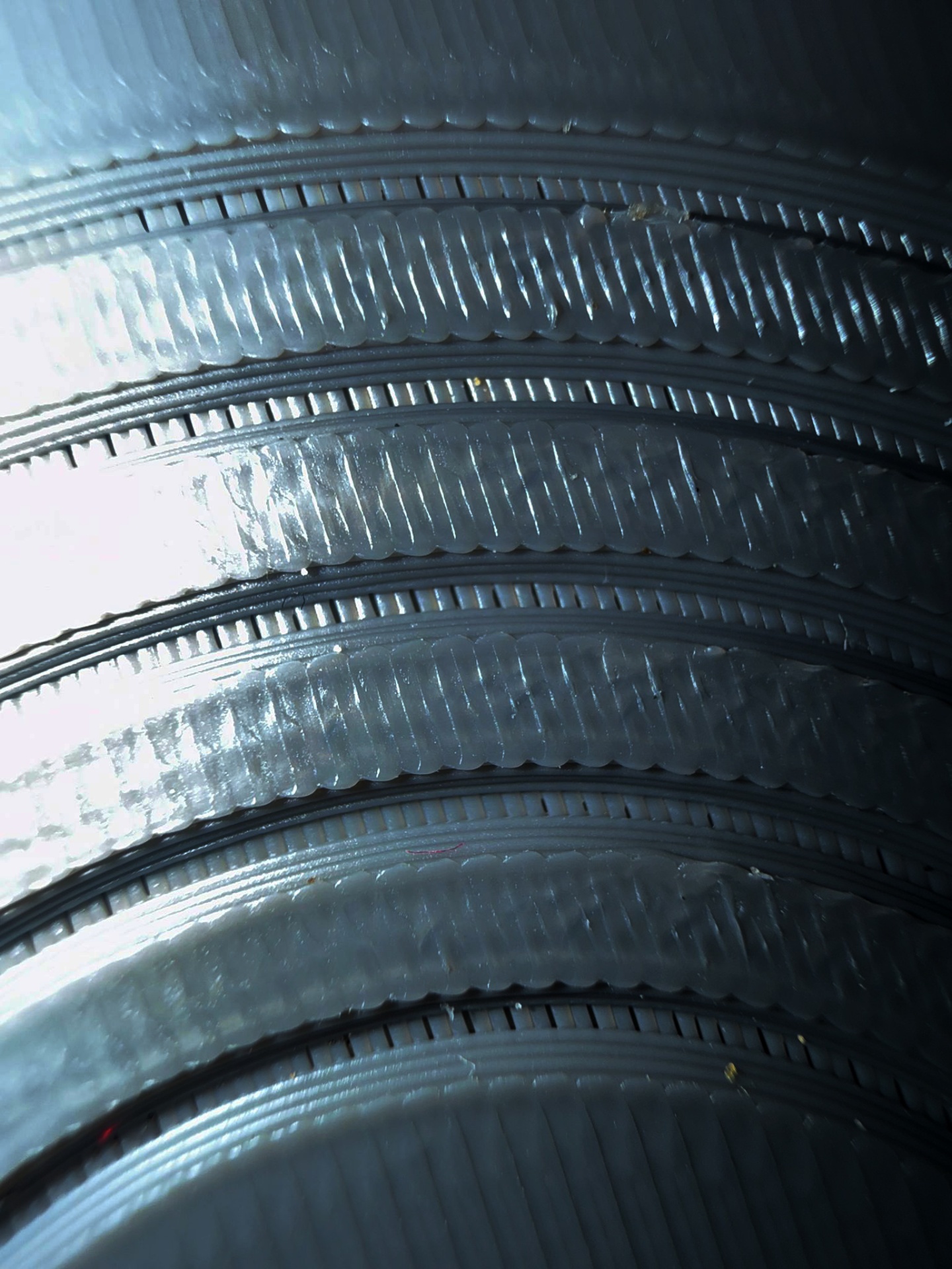 Close-up of a printed record groove under raking light
